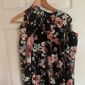 I am selling a black small cold shoulder top with flowers for $10.
